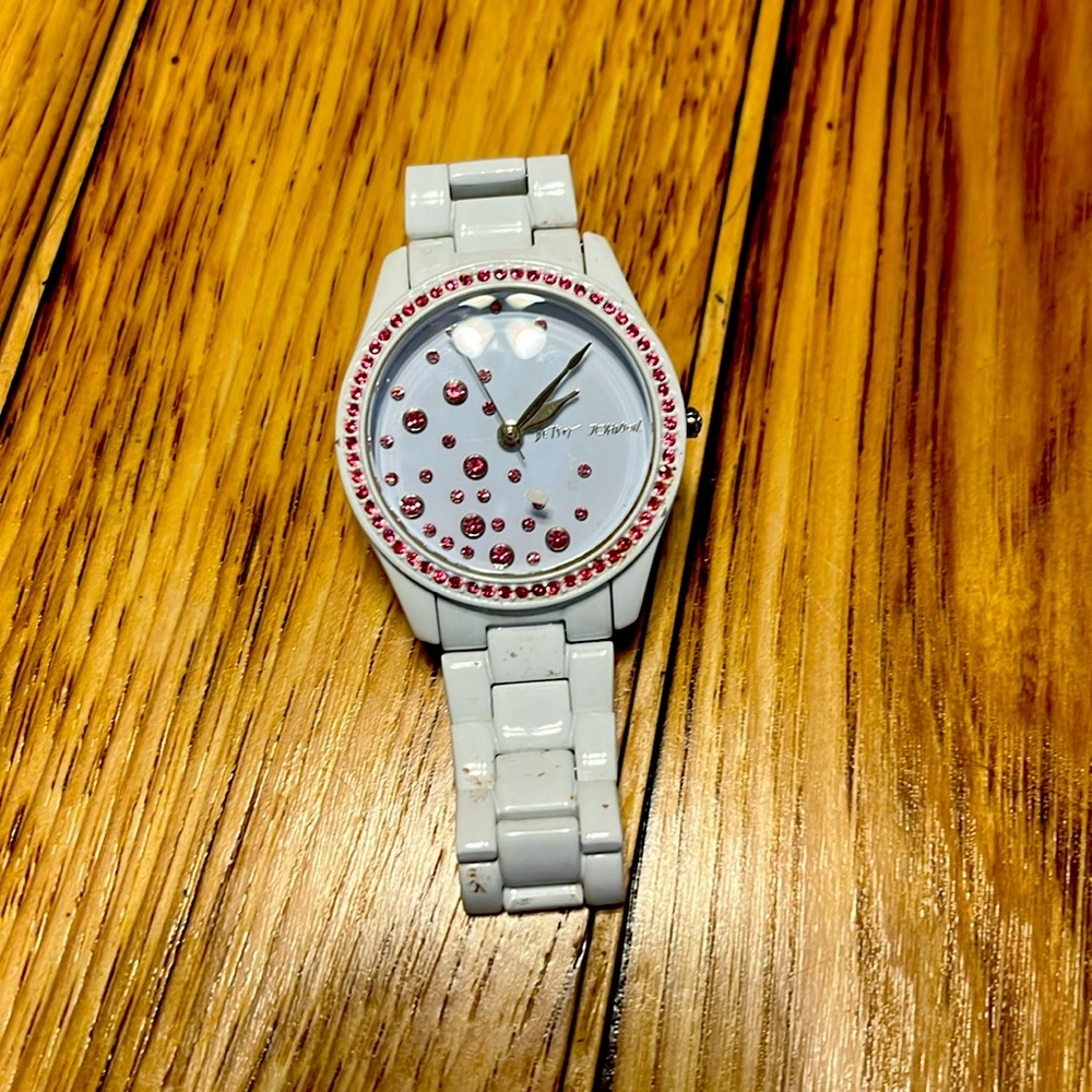 Betsey Johnson Women's 
Pink Crystal Dial White Stainless Steel Band Watch